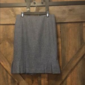 Light blue pleated wool skirt.